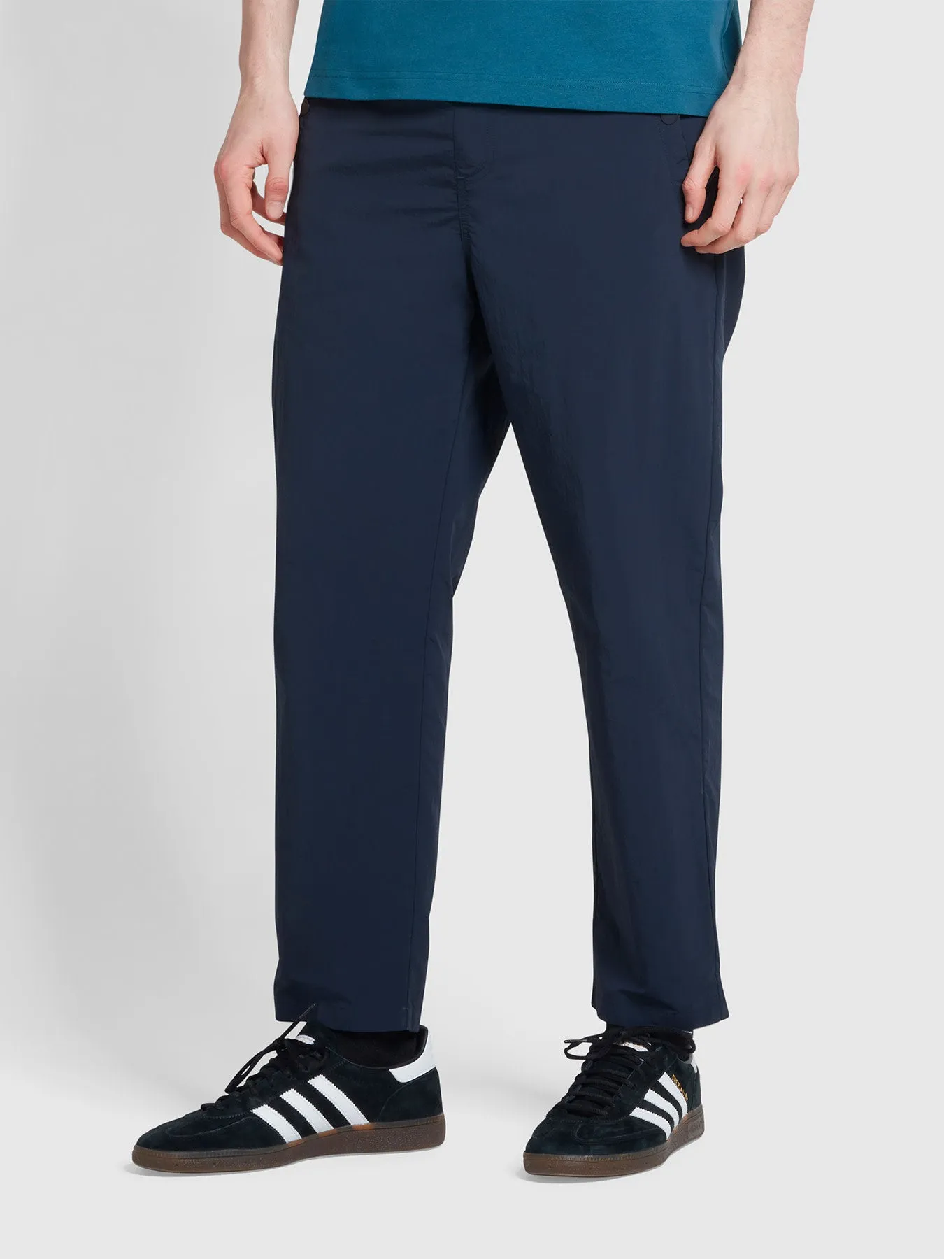 Hawtin Relaxed Tapered Fit Technical Trousers In True Navy