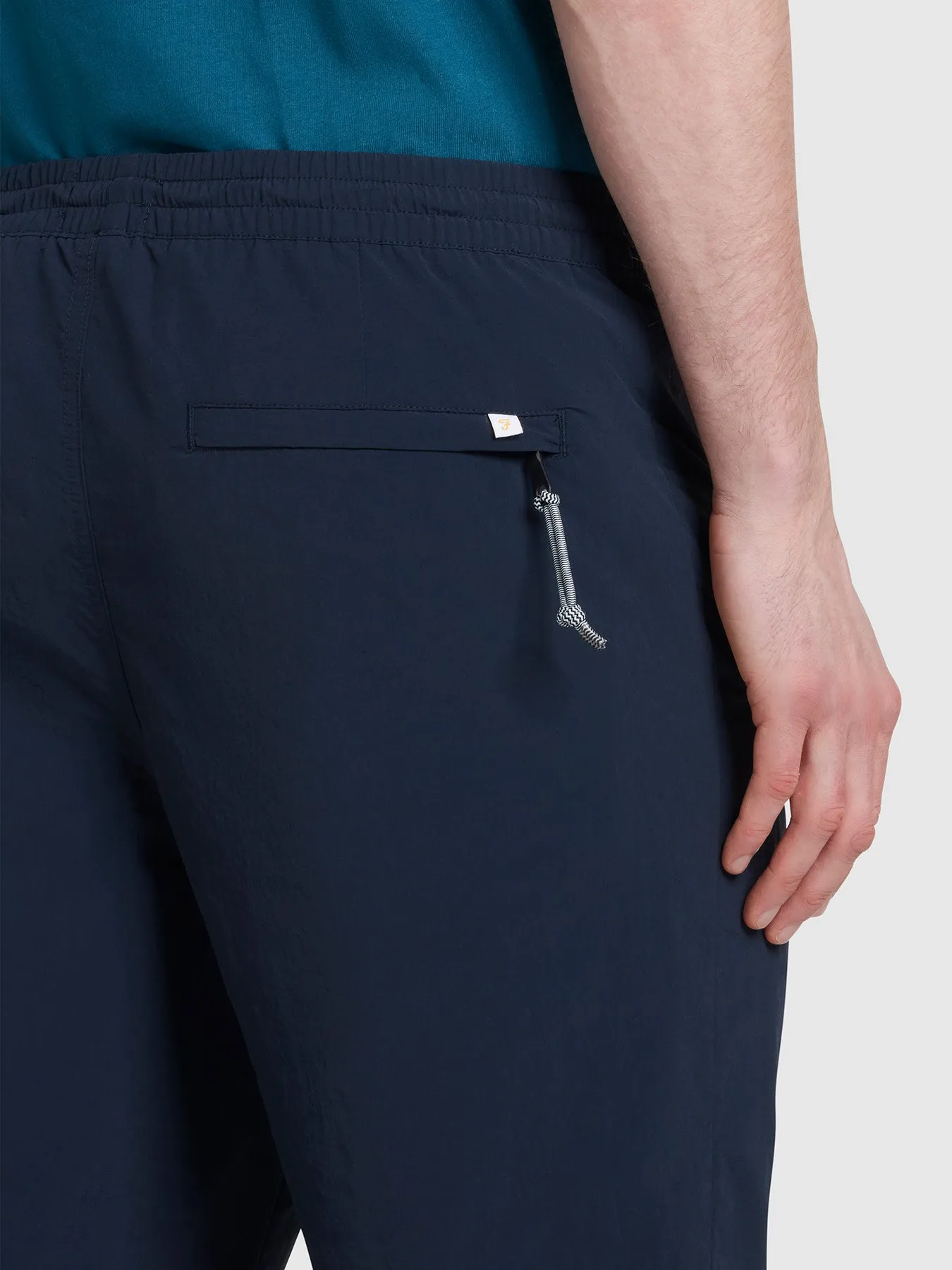 Hawtin Relaxed Tapered Fit Technical Trousers In True Navy