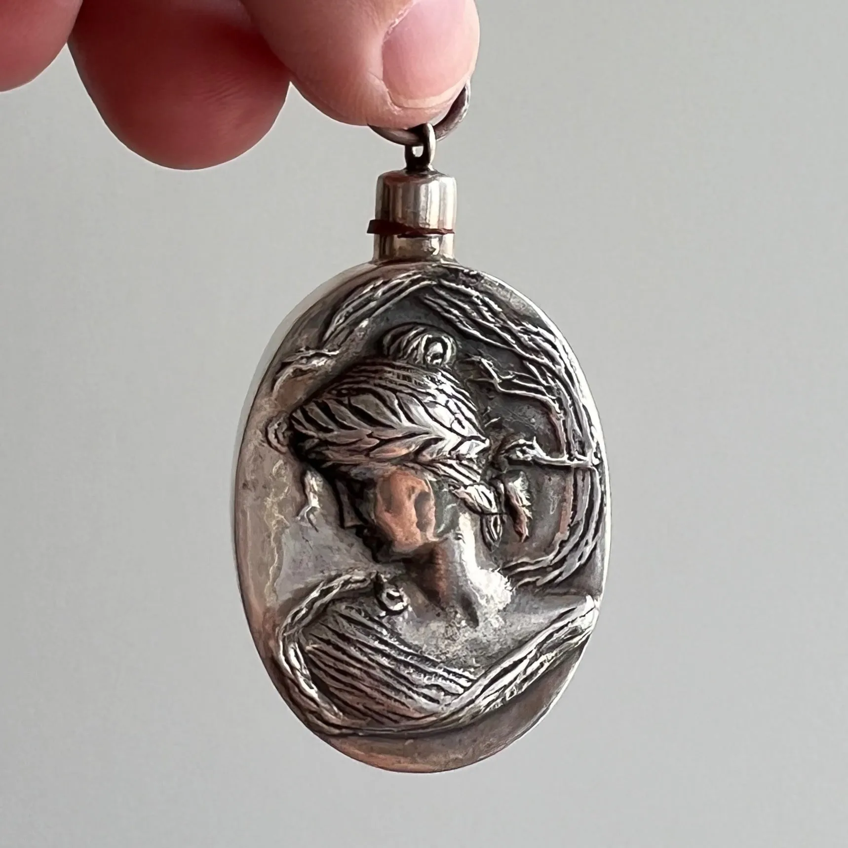 V I N T A G E // wind blown side eye / sterling silver art nouveau style perfume bottle / a pendant